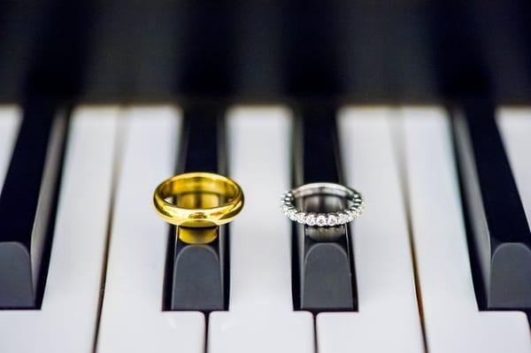 Creative wedding ring photo on a piano at Serendipity Garden Wedding venue in Oak Glen