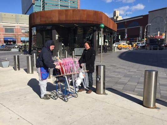 Vendor selling magic wands outside of Disney on Ice at the Barclays Center