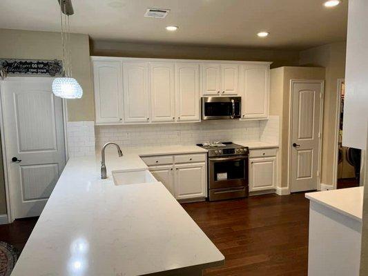 Complete kitchen remodel including painting cabinets, levelled out the countertops and upgraded flooring