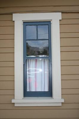 Repaired termite damaged window with new side rail from salvage window and finished with full paint.