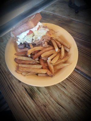 The TCB burger. Piled high with lettuce, tomato, slaw, 6oz of Wood Fired BBQ, and an 8oz burger topped with melted cheddar.