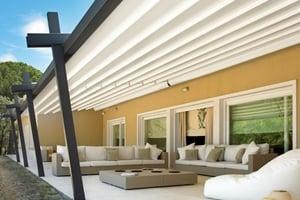 Retractable patio cover system with angled front posts