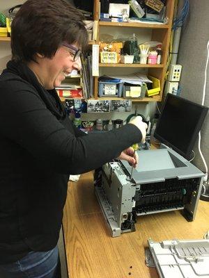 Sue wrenching the bench. Fixing your printers back to perfection.