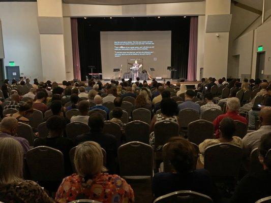 Service gathering in the Koshland Theater at the JCC in Palo Alto.