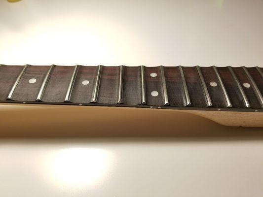 Scalloped guitar neck