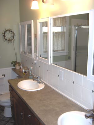 Drake Bathroom with custom cabinets, med cabinets, and ceramic tile.