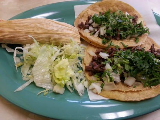 Two steak tacos and one pork tamal