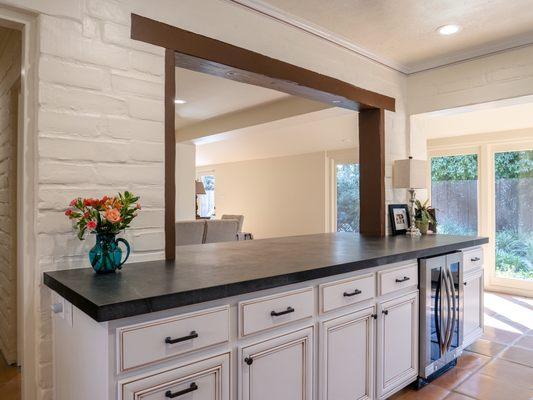 A soapstone counter space that links the kitchen & living areas.