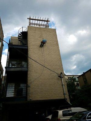 Waterproofing  split face /  cinder block  walls  to prevent  water seepage / damage  in Chicago as well as caulking of  windows and  doors