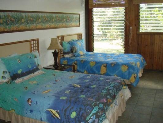 Two full size beds downstairs at the Pualani Home, Kapoho, Big Island Hawaii