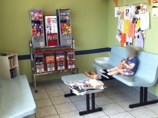 More than one place to sit. Books to read. Snacks to buy. Public notices (lost animals, adverts, etc.) Natural lighting. Not depressing! :-)