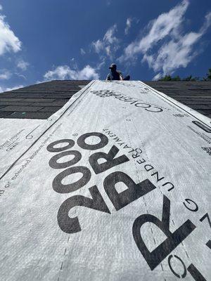 Covering up missing shingles to add protection, as we prepare for a roof replacement!