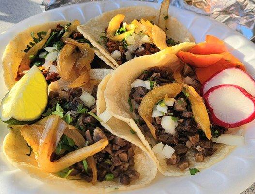 Four tacos (2 lengua or beef tongue, 1 adobada or pork, 1 asada or beef).