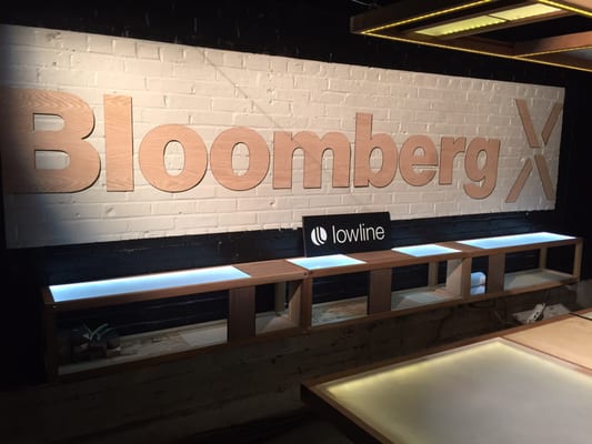 Bloomberg X oak wood sign at the Lowline NYC.