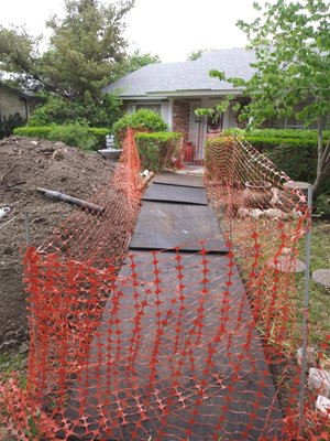 Sewer line excavation properly secured overnight to eliminate possibilities of accidents to children as it is also standard on any digs.