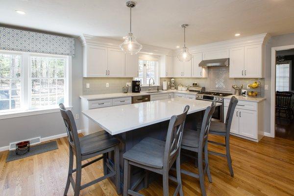 Kitchen remodel using existing cabinetry, light carpentry and cabinet painting.