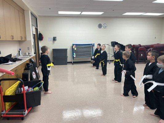 One of our Lil Champs leading his class in our Black Belt Commitment