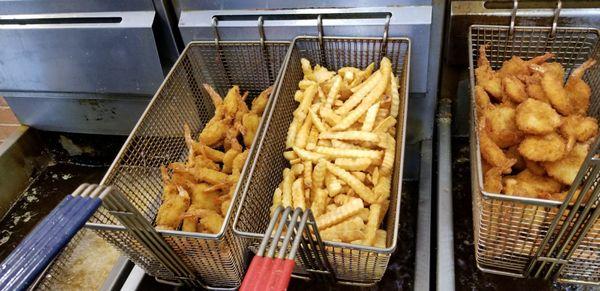 Frog legs, Dried, shrimp, and hush puppies ready to eat!  Best Fish Fry in town.