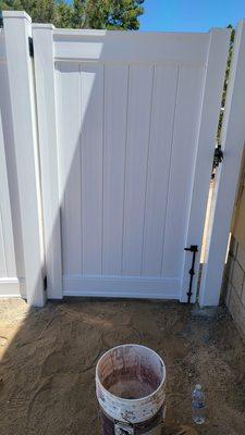 Vinyl fence gate with double lockable latch and drop rod  holder