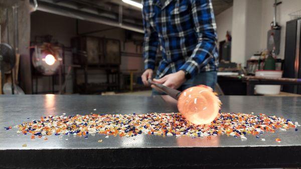 Rolling glass in colored crystals.