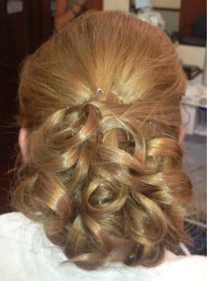 An updo I received from a stylist at TGF for me wedding pictures