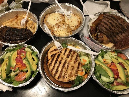 Top: Skirt steaks, cheese arepas, carne asada with chicharron. Bottom: Avocado salads and grilled chicken