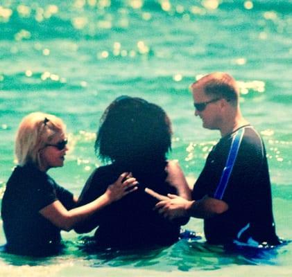 Pastors Marc & Tabatha baptizing in the gulf