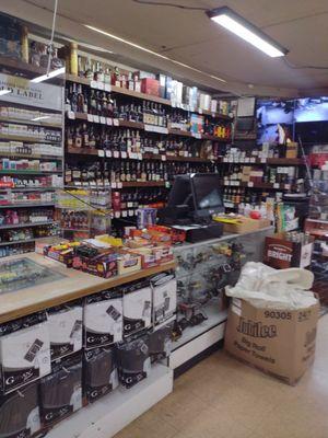 Front counter with lots of choices of whisky to choose from