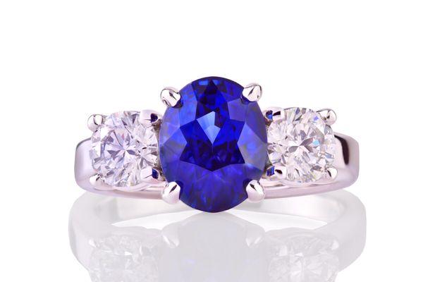 Boston style Inky Blue Burmese Sapphire with 2, .56ct VS1, F Colored Diamonds in 14k white gold. Designed by PK McCarthy