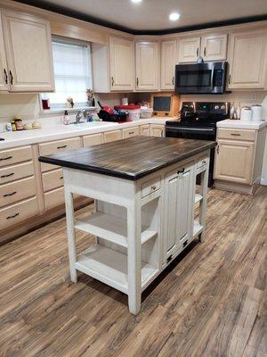 Our 36x50 Farmhouse Island with Black Farmhouse Mahogany Top is sure to add charm and warmth to your kitchen.