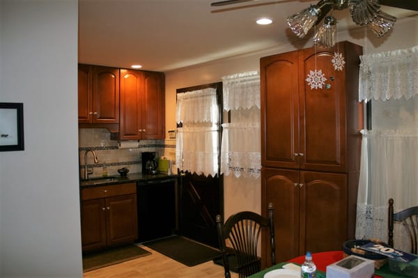 The view from the dining room into the kitchen where there used to be a wall.