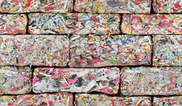 Bricks of shredded paper ready to be recycled