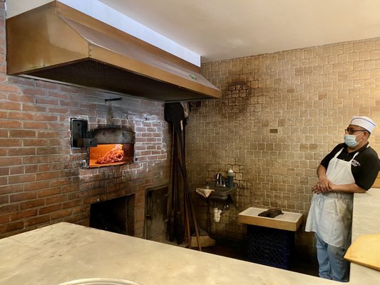 Coal oven and chef Roberto