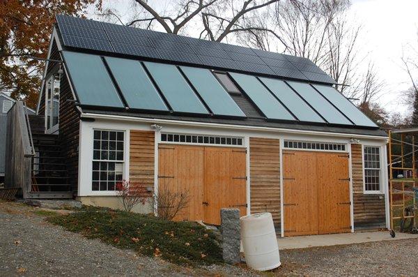 Solar electric and hot water systems on a garage.