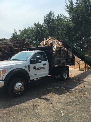 One of our delivery trucks loaded with green firewood