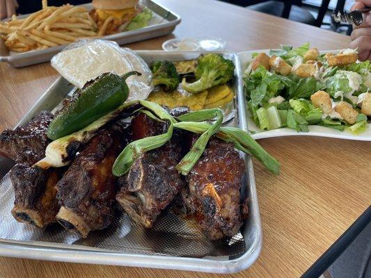 Ribs grilled veggies and a cesar salad