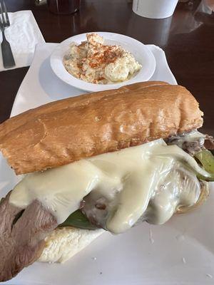 Their Philadelphia Cheese Steak Sandwich. Side of potato salad.