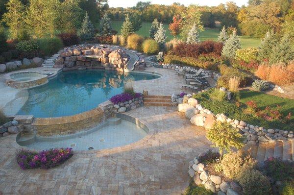 Bull Valley- Installed Waterfall, Travertine Paver Patios, Boulder Walls, Landscape Beds.