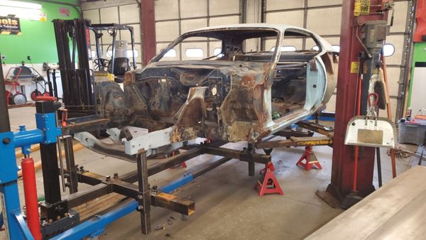 1971 Road Runner mounted on rotisserie with spine bracing. In for extensive metal work.