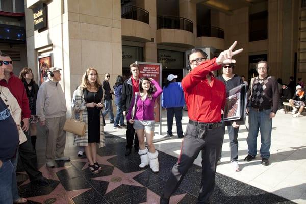 Our guide Michael Hernandez narrates the story of Awards Walk.