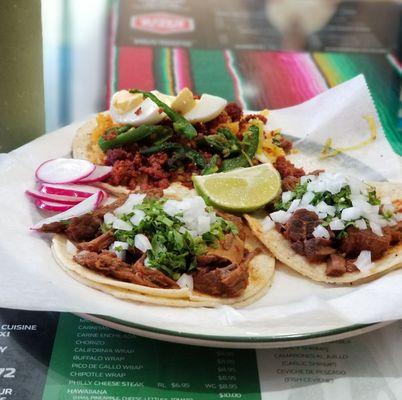 Tacos de birria in front; taco placero in the back.