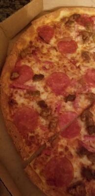 This is a picture of a MEAT LOVERS PIZZA. No meat  , no decent amount of cheese, no sauce.  Pizza Hut, Ha more like dried up cardboard.