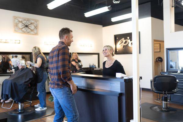 Stylist checking out a client