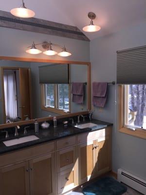 Custom vanity with granite counter, new casement window unit and new baseboard heat