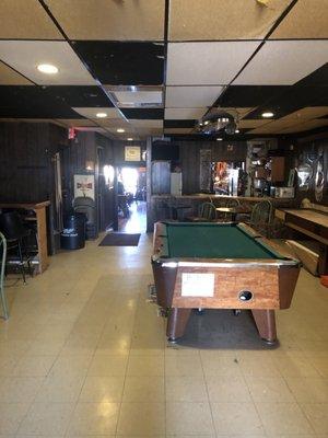 Pool table in back and shuffleboard