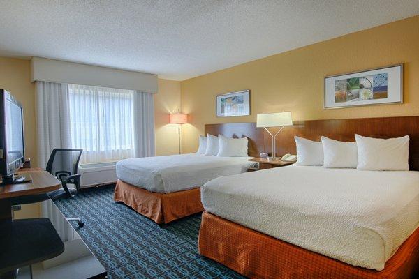 With room for more guests, enjoy and relax in a room with two beds.