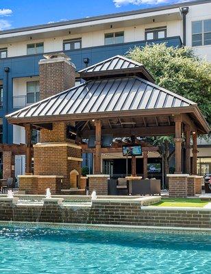 Outdoor cabana and tranquil water feature