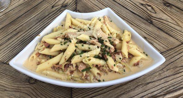 Spicy chicken carbonara with local hot peppers.