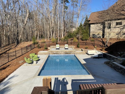 Pool tanning deck stonework.