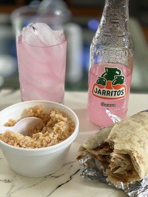 Carnitas burrito, side of rice and guava soda.